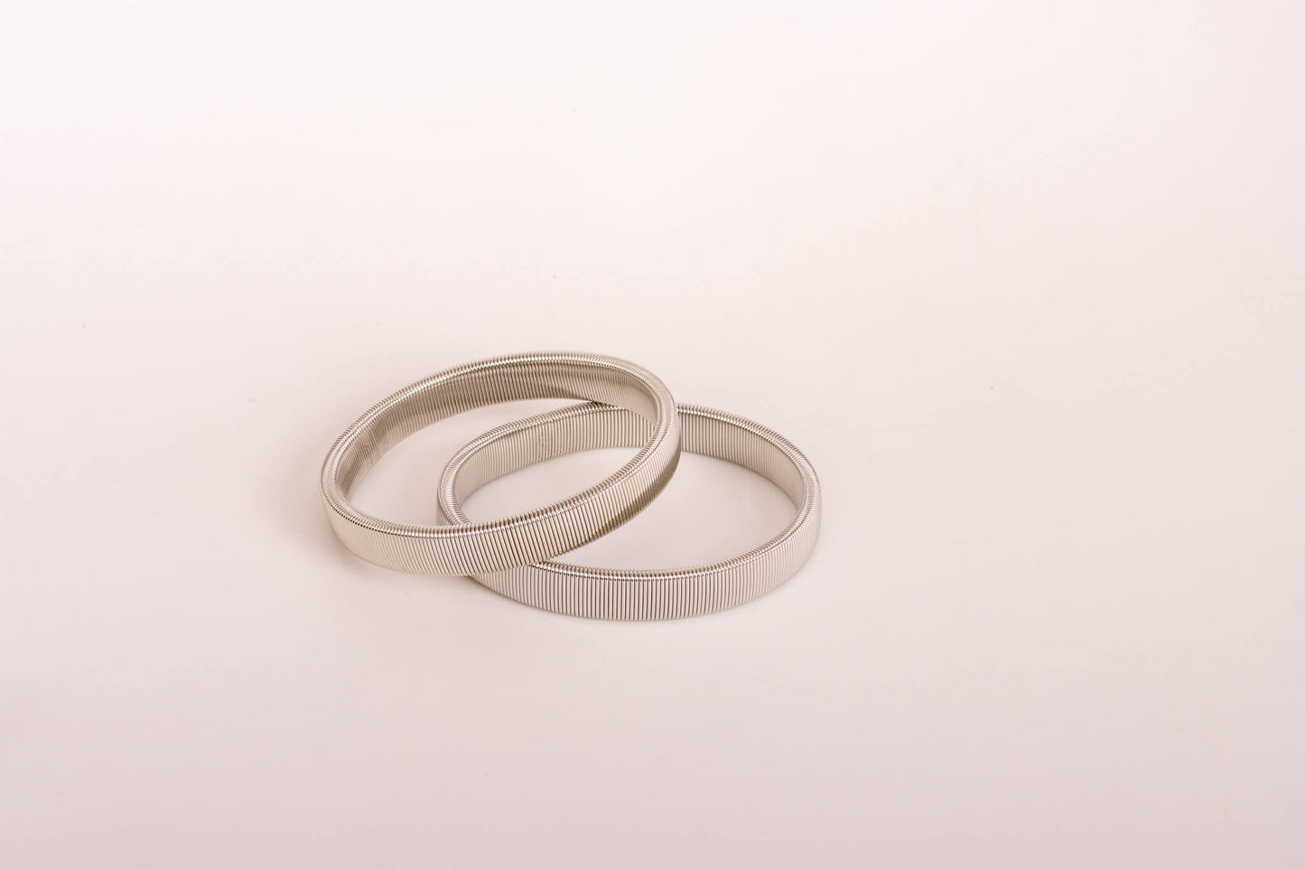 silver coloured metal sleeve band fashion accessory