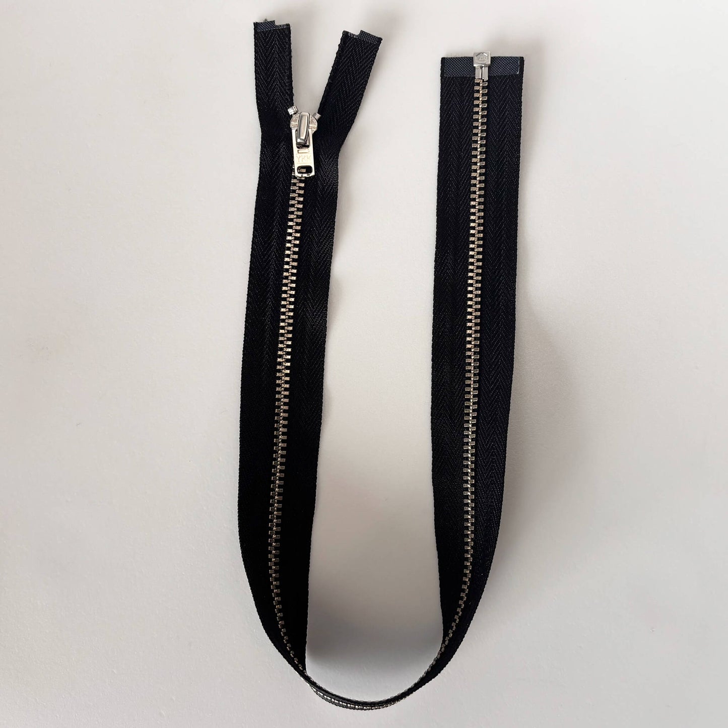 open ended black metal jacket zip