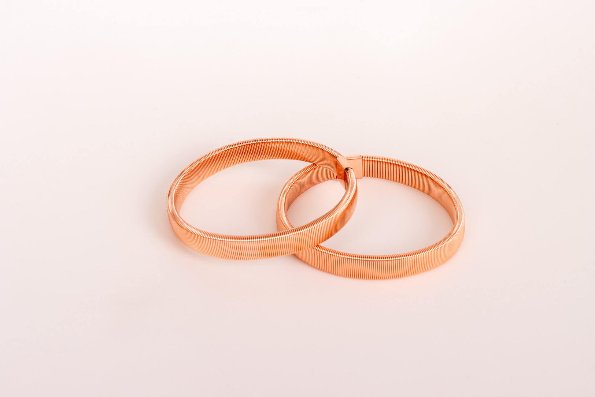 Rose gold coloured metal sleeve band fashion accessory